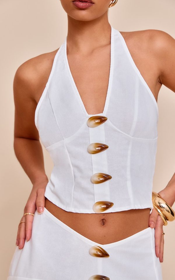f030e741819a308808af040795c609cc60b5b126_CNM8779_4_white_woven_halterneck_button_detail_top