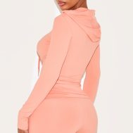 f0485ec5d7c7d6c6be180e24b0a90de44591c4df_CNM1097_2_shape_peach_sculpted_zip_through_hoodie