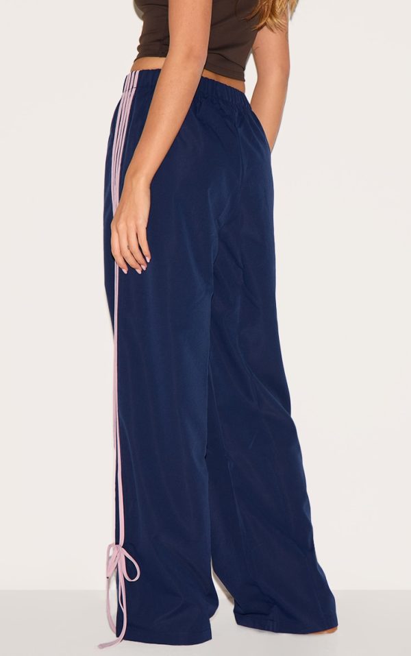 f0e93f9d1be35884296671d4cf252a3ce6af8510_CNK3664_3_navy_shell_bow_detail_track_pants