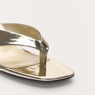 f159d7b2edb0bb8754d17d71cd56c7ba50ec0eb9_CNM1046_4_gold_pu_round_toe_thong_mid_block_heeled_mules