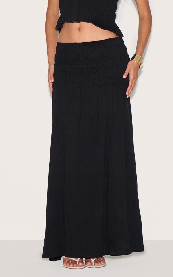 f1df1e79b088d5a810f1b75f64164bedd6bcc7af_CNM9995_2_black_textured_shirred_panel_mid_rise_maxi_skirt