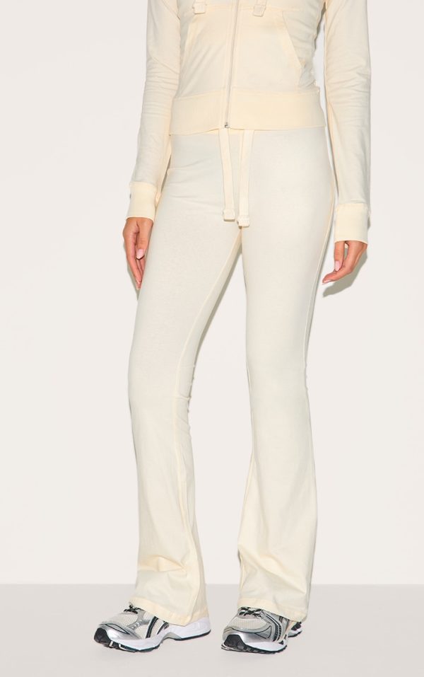 f287079e2a2af8fbf388deda4651b4441236bab0_CNM0344_2_cream_low_rise_skinny_flare_trousers