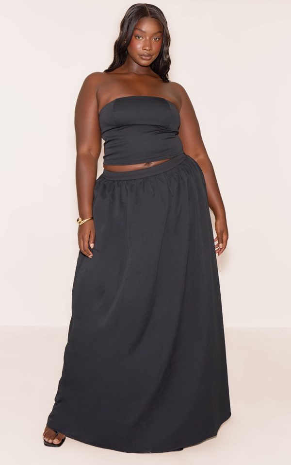 f411a9ca05d19acabd5dd215e9228bb6c7b3dfc9_CNM7205_1_plus_black_woven_band_detail_pleated_maxi_skirt