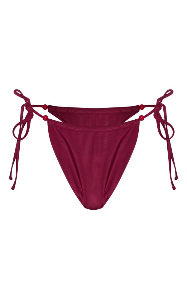 f46f01750ee34acbe347a90d80ca3d571e243106_CNL3337_5_burgundy_beaded_tie_side_bikini_bottoms