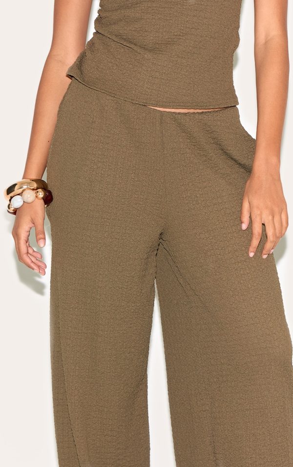 f48ad27799ab3f9bb15c03d997a5ec1710753814_CNM8869_4_dark_green_textured_mid_rise_wide_leg_trousers
