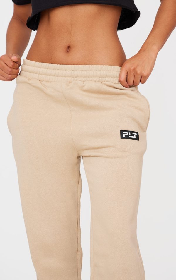 f542e4f4cce7afc3db47d516127d7df5d25f2fae_CNE5666_4_prettylittlething_sand_badge_detailed_straight_leg_joggers