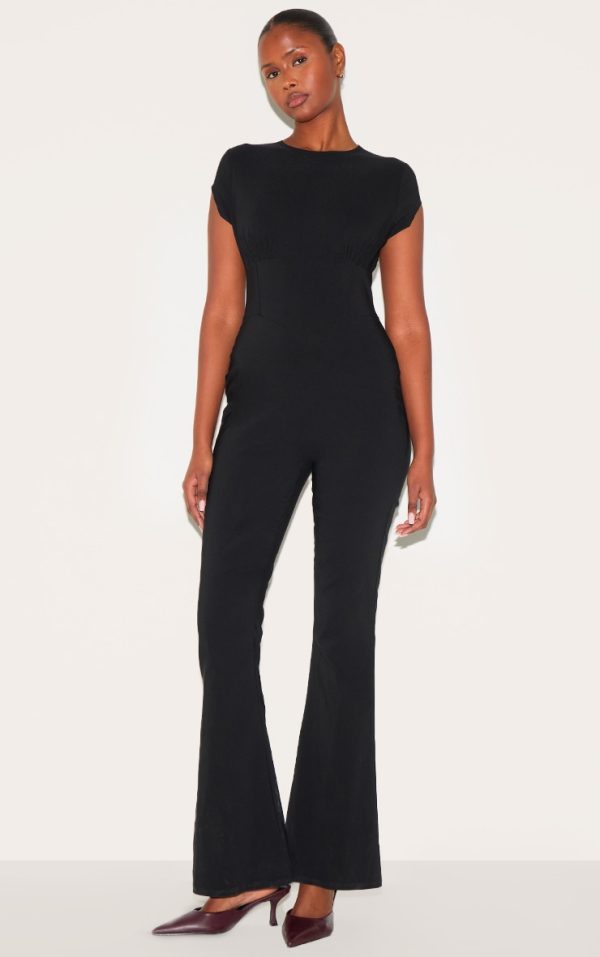 f574cc2bb221018ead7c78b7820d475b60efaafc_CNM3120_1_black_stretch_woven_corset_detail_cap_sleeve_flared_jumpsuit