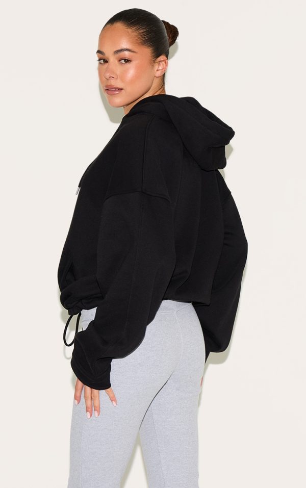 f5ca6bf4923d461bbde459633fccfd7a18130a07_CNL9664_2_black_oversized_zip_up_toggle_waist_hoodie