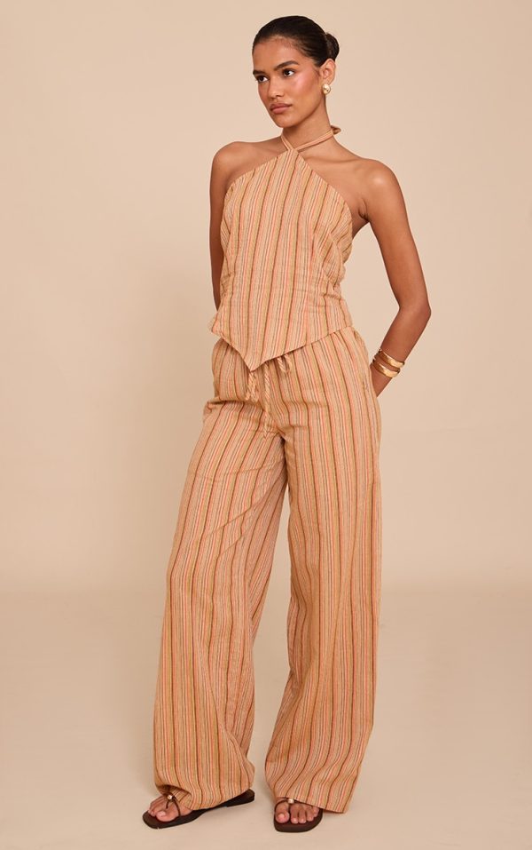 f5d08c0430378a33d1b7197ed47fbedd973ba9ab_CNM6829_3_apricot_pinstripe_halter_neck_pointed_hem_top