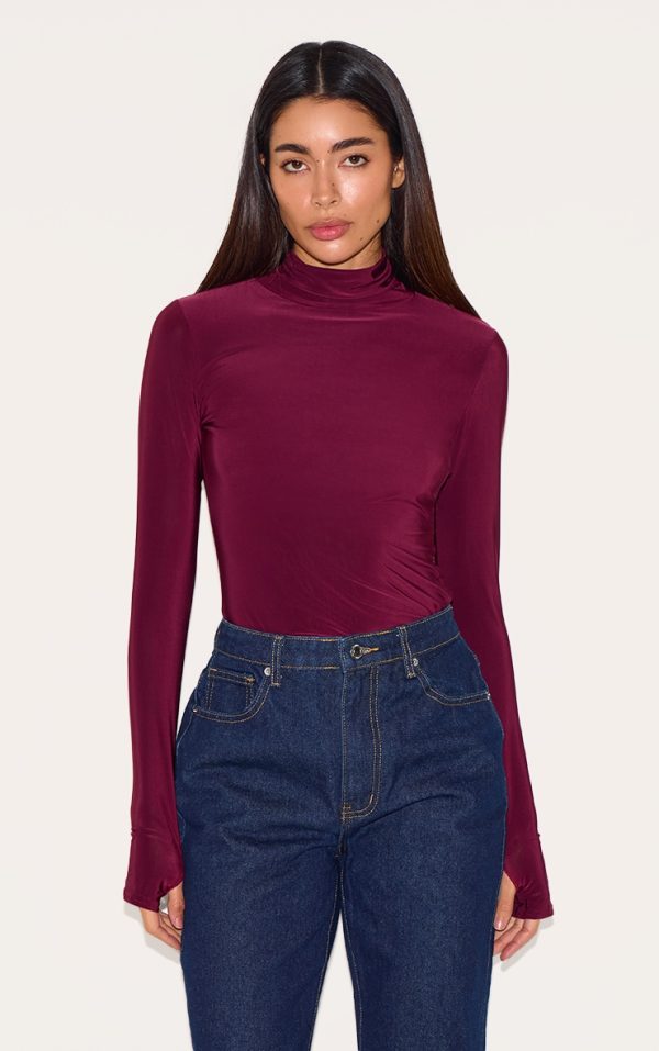f657e726e082a7560000e052213f49ec737c9ce9_CNM1401_1_plum_slinky_high_neck_thumb_detail_long_sleeve_top