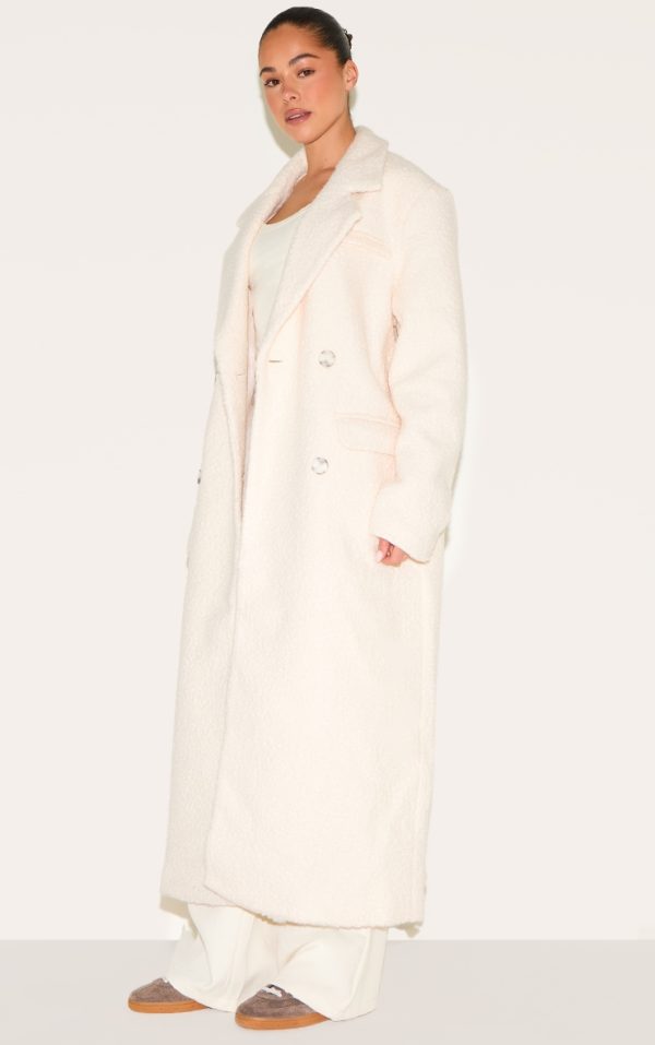 f69788abacf35098e79347689ff8e751ee7c22ae_CNJ9059_3_ecru_boucle_double_breasted_structured_maxi_coat