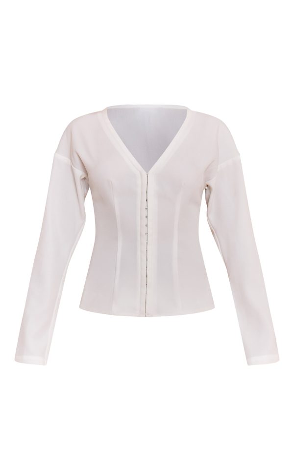 fbb39a133c2cb4940cb8829e3d3c381dc6fa9753_CNM6999_5_petite_white_collarless_hook_and_eye_cinched_waist_long_top