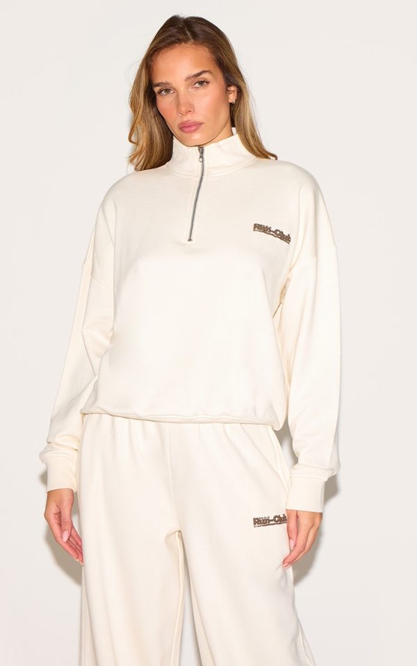 fc15a4c9a5e74a3dc32fa5b5a09776e0f27ad619_CNM4682_1_cream_run_club_puff_print_quarter_zip_sweatshirt