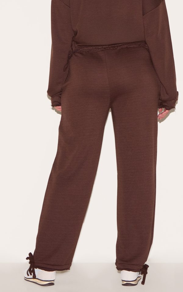 fc1a745f8ffdbe2888785092520a410642c8a799_CNM1974_3_shape_chocolate_highwaisted_back_slogan_joggers