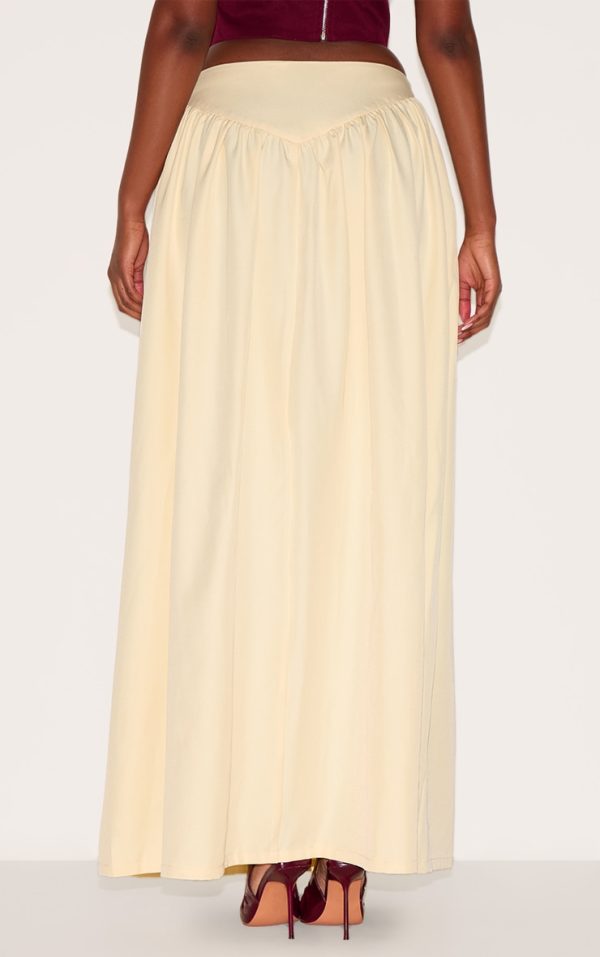 fcdf393036b4c819f593843393087bd55ca5f3e1_CNL9321_3_almond_dipped_waist_structured_a_line_maxi_skirt-1