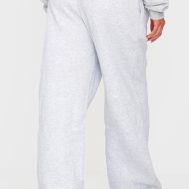 fce4d2c4dfd2929a41ffa232b451637972cec003_CNJ5145_3_prettylittlething_ash_grey_badge_detail_mid_rise_wide_leg_joggers